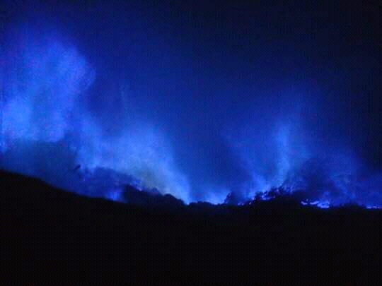 Blue fire coming up at night